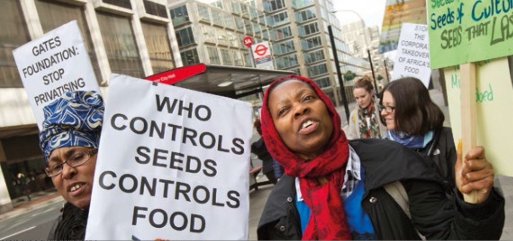 Food sovereignty activists protest outside a secret elite corporate seed conference convened by the Bill and Melinda Gates Foundation (BMGF) and the United States Agency for International Development (USAID). Organised by Global Justice Now. London. (cc) Jess Hurd https://flic.kr/p/rtgpiu